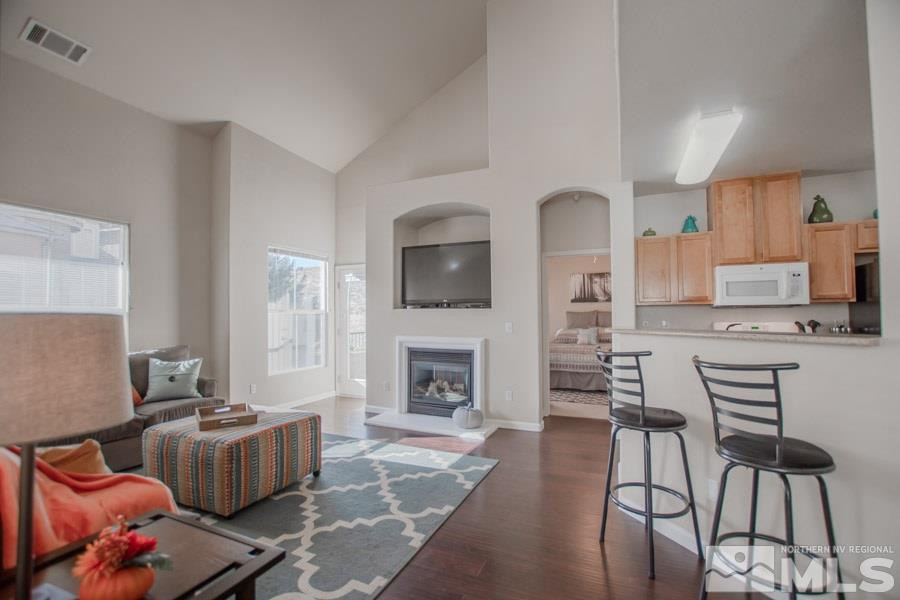 9050 Double R Boulevard, Unit NV Reno, NV 89521 - Photo 5 of 25 a living room with furniture and a fireplace