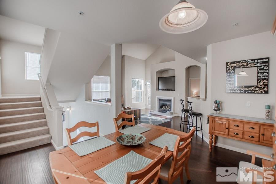 9050 Double R Boulevard, Unit NV Reno, NV 89521 - Photo 8 of 25 a view of a dining room with furniture and wooden floor