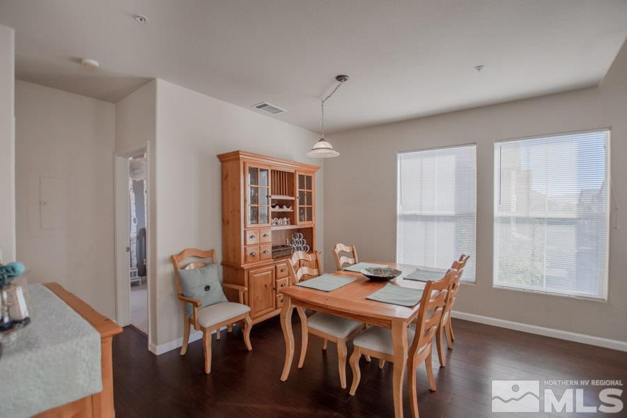 9050 Double R Boulevard, Unit NV Reno, NV 89521 - Photo 10 of 25 a view of a dining room with furniture window and wooden floor