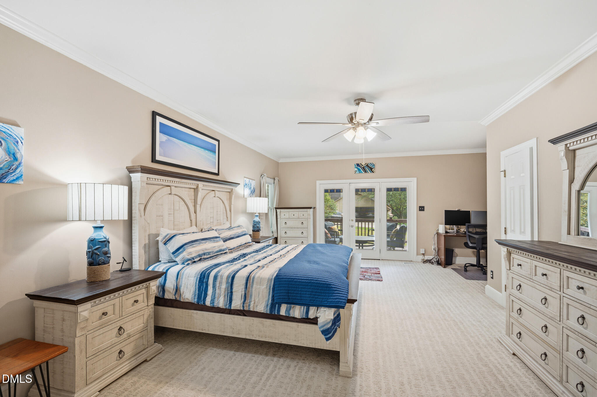 3735 Stoneybrook Drive Durham, NC 27705 - Photo 21 of 44 a bedroom with a large bed and a chandelier