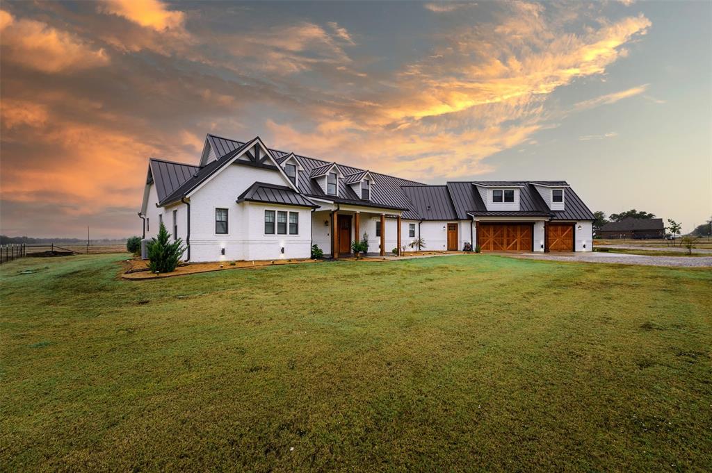 a view of a house with a big yard