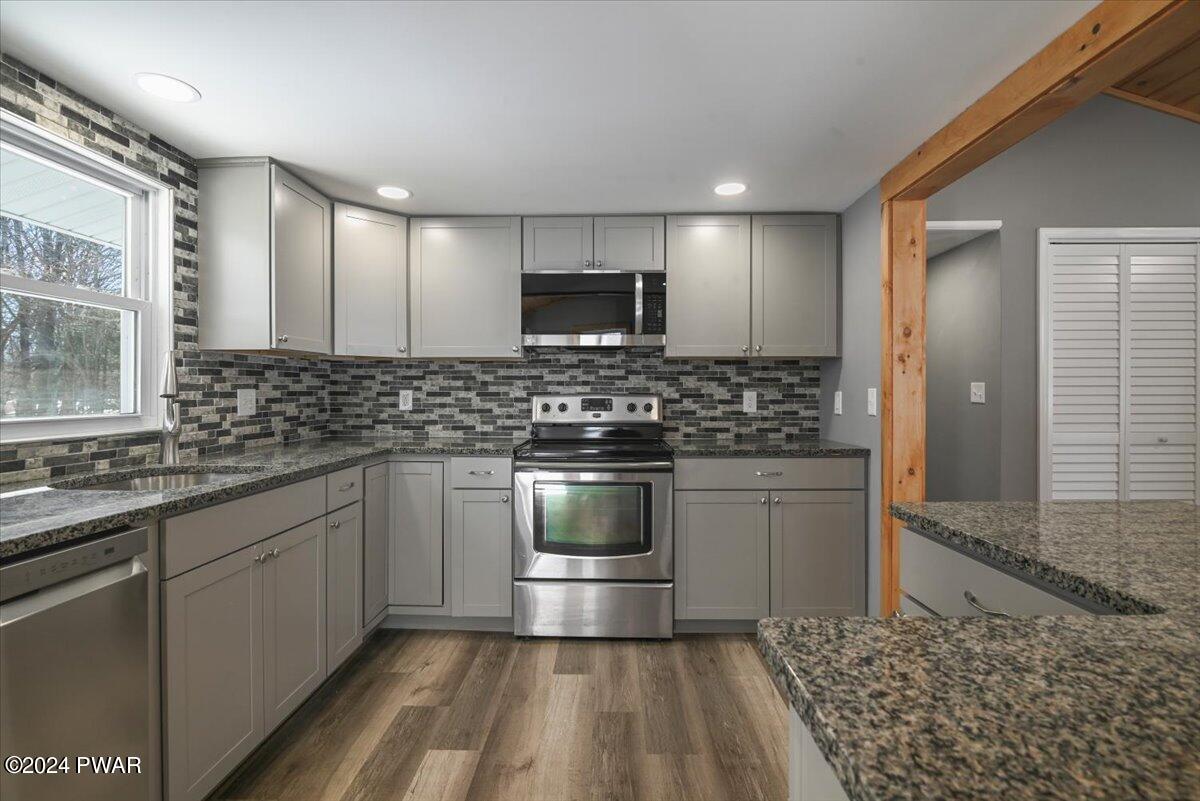 166 Skyview Road Dingmans Ferry, PA 18328 - Photo 39 of 44 a kitchen with a sink and a stove top oven