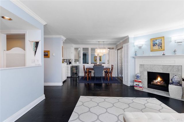 a living room with furniture a fireplace and a table