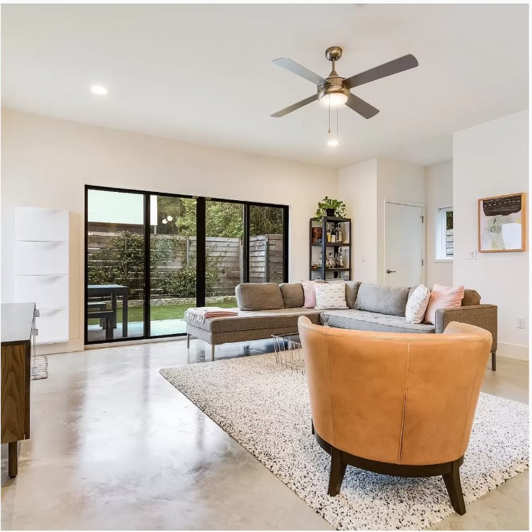 2101 Montopolis Drive, Unit 8 Austin, TX 78741 - Photo 1 of 1 a living room with furniture and a large window with garden view
