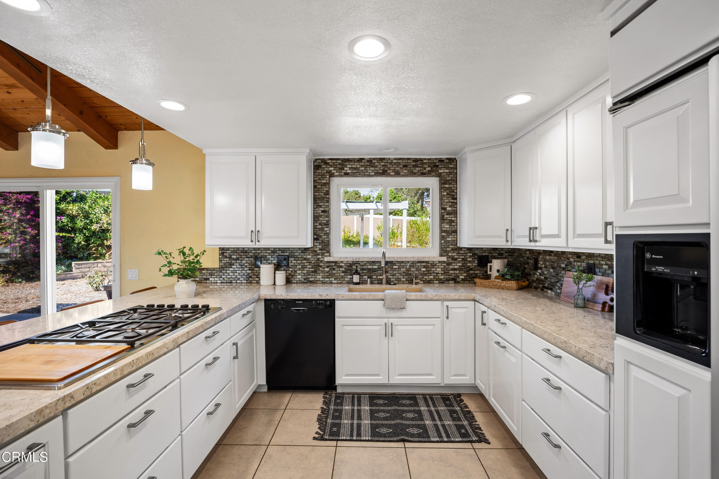 531 Ridgeline Drive Oak View, CA 93022 - Photo 14 of 36 a kitchen with a sink stove and cabinets
