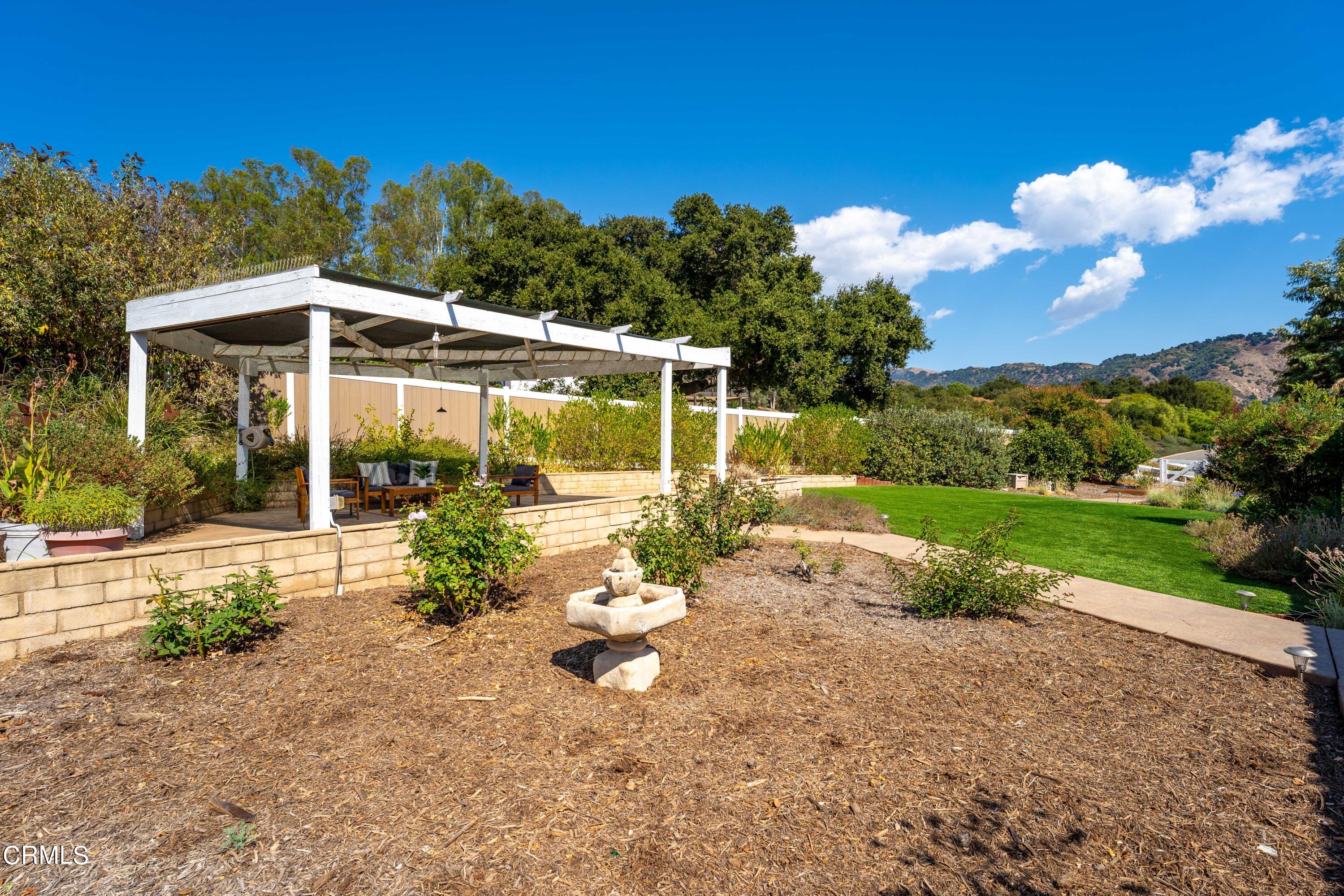 531 Ridgeline Drive Oak View, CA 93022 - Photo 28 of 36 a view of a chair and tables in the garden