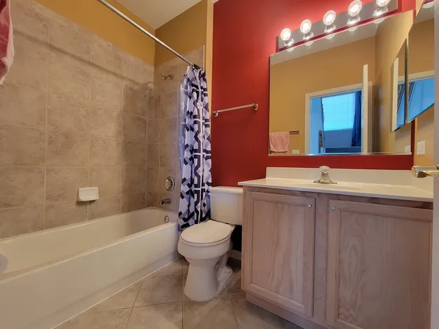 a bathroom with a toilet a sink and bathtub
