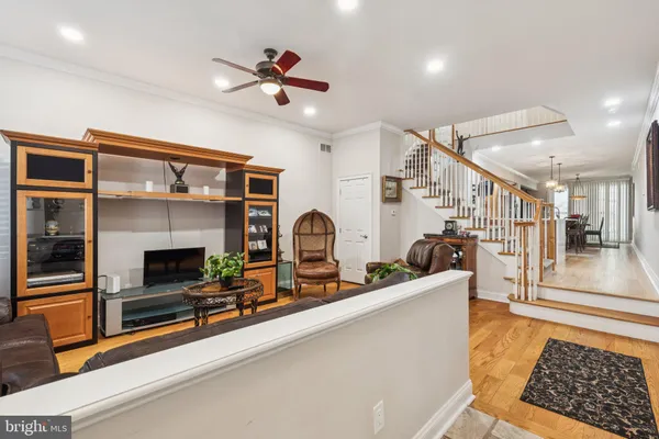 a living room with furniture a dining table and chairs