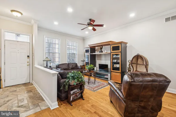 a living room with furniture couches and a fireplace
