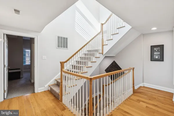 a bathroom with a sink vanity granite shower and a mirror