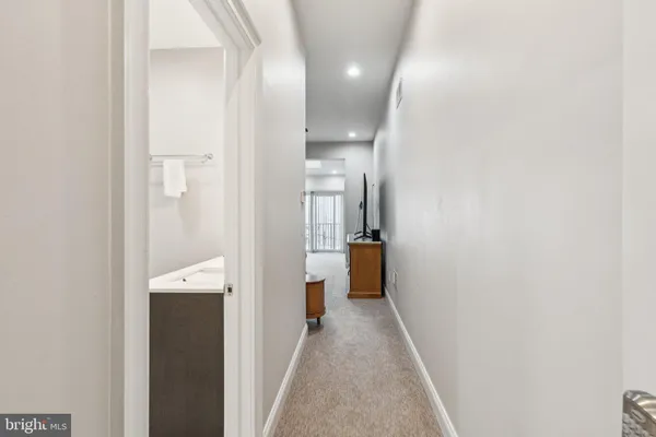 a bathroom with a sink shower and a mirror