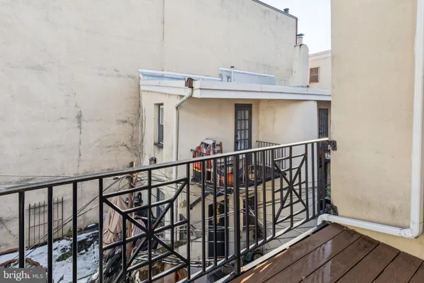 a living room with furniture and a ceiling fan