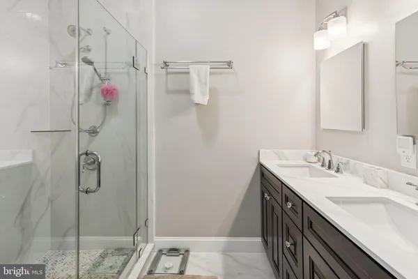 a bedroom with a bed and a large mirror