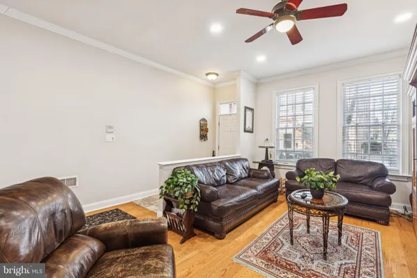 a view of entryway livingroom and hall with wooden floor