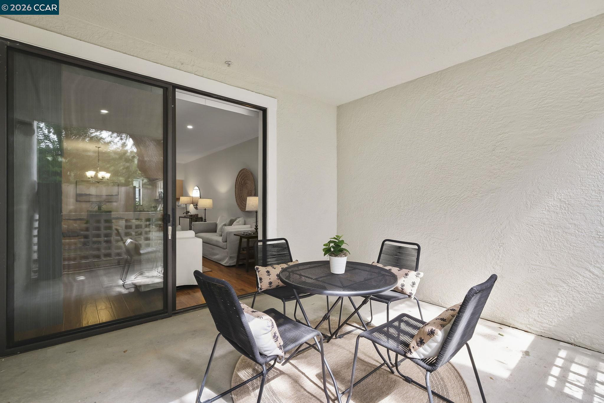 2586 Oak Road, Unit 130 Walnut Creek, CA 94597 - Photo 10 of 31 a dining room with furniture and lamp