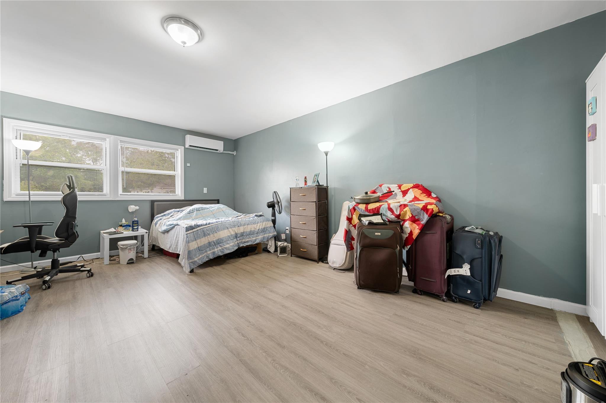 51 Joline Road Port Jefferson Station, NY 11776 - Photo 25 of 38 a bedroom with furniture and a wooden floor