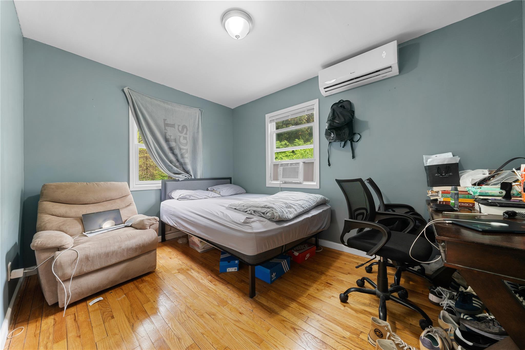 51 Joline Road Port Jefferson Station, NY 11776 - Photo 26 of 38 a living room with furniture and a table