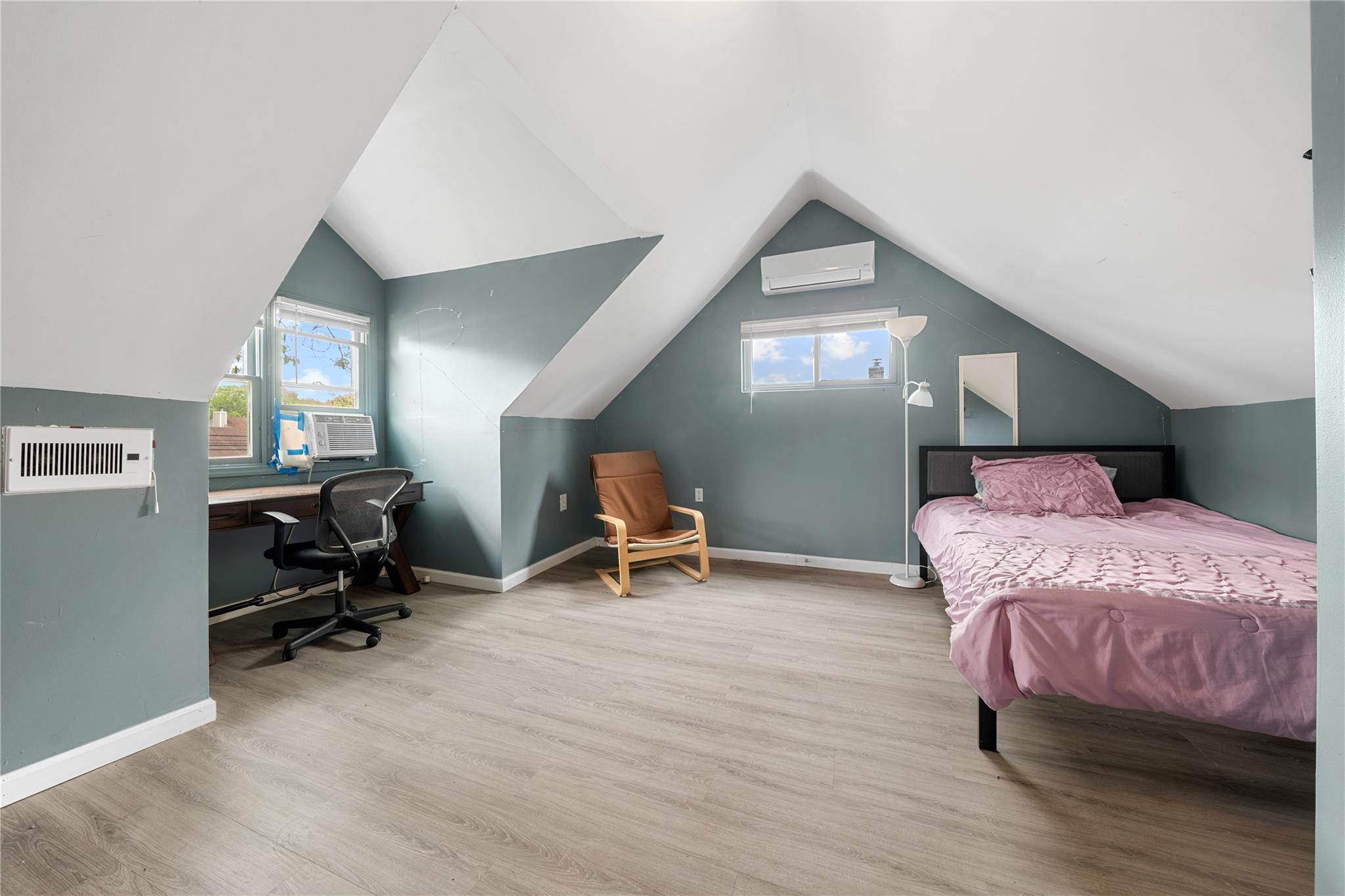 51 Joline Road Port Jefferson Station, NY 11776 - Photo 28 of 38 a bedroom with bed and a chandelier