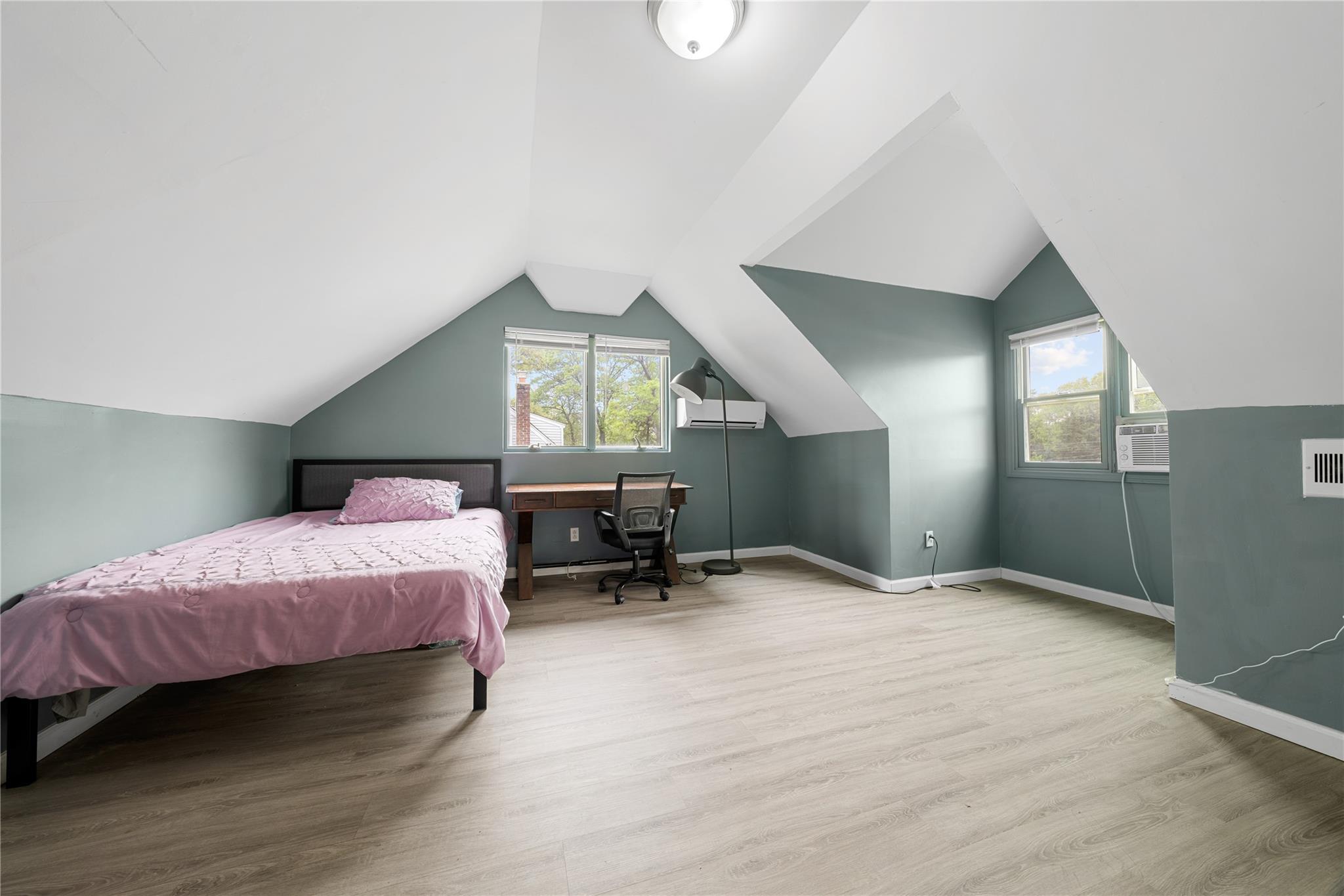 51 Joline Road Port Jefferson Station, NY 11776 - Photo 30 of 38 a spacious bedroom with a bed and a view of bathroom