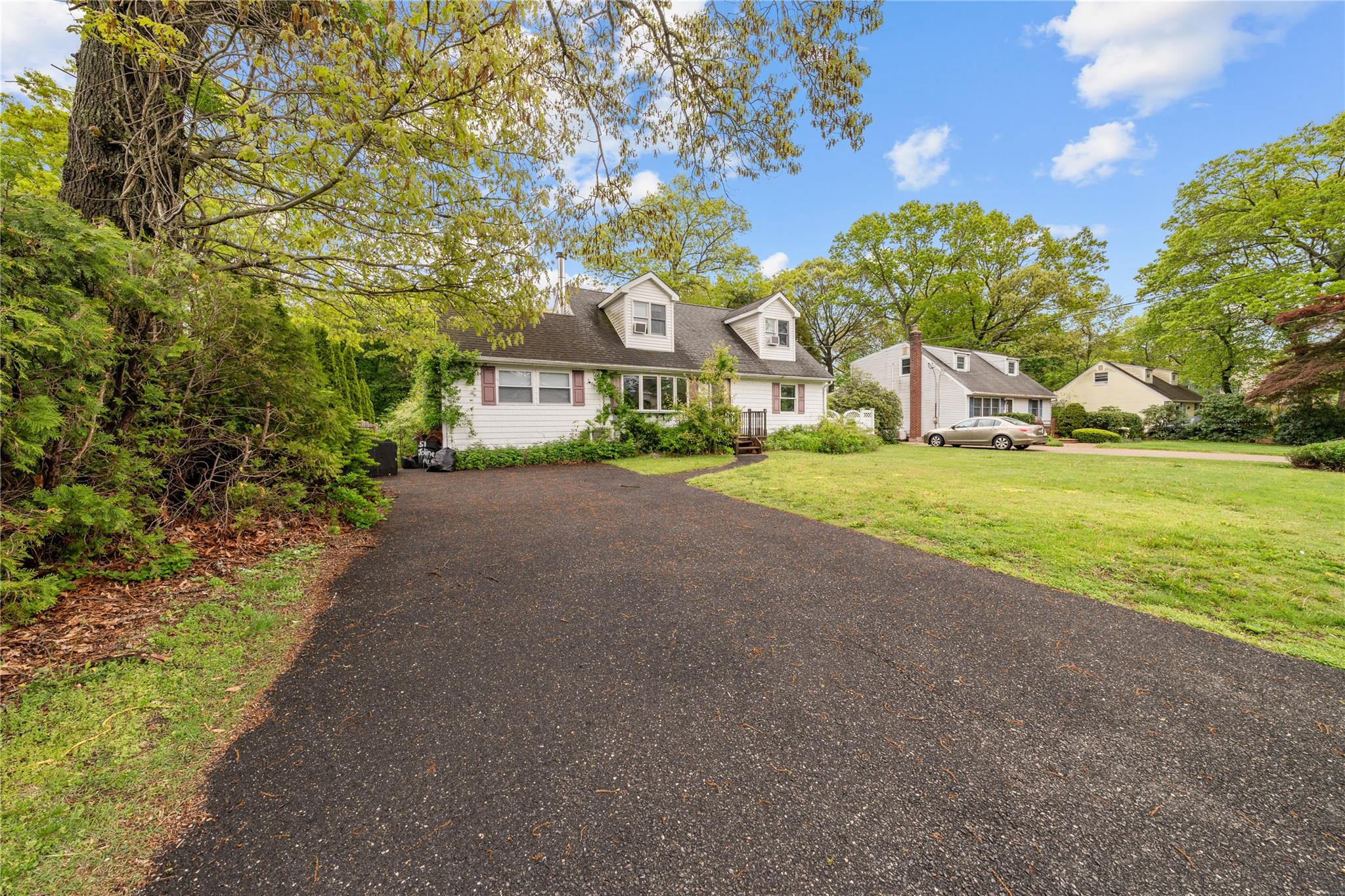 51 Joline Road Port Jefferson Station, NY 11776 - Photo 3 of 38 a view of a house with a yard and potted plants
