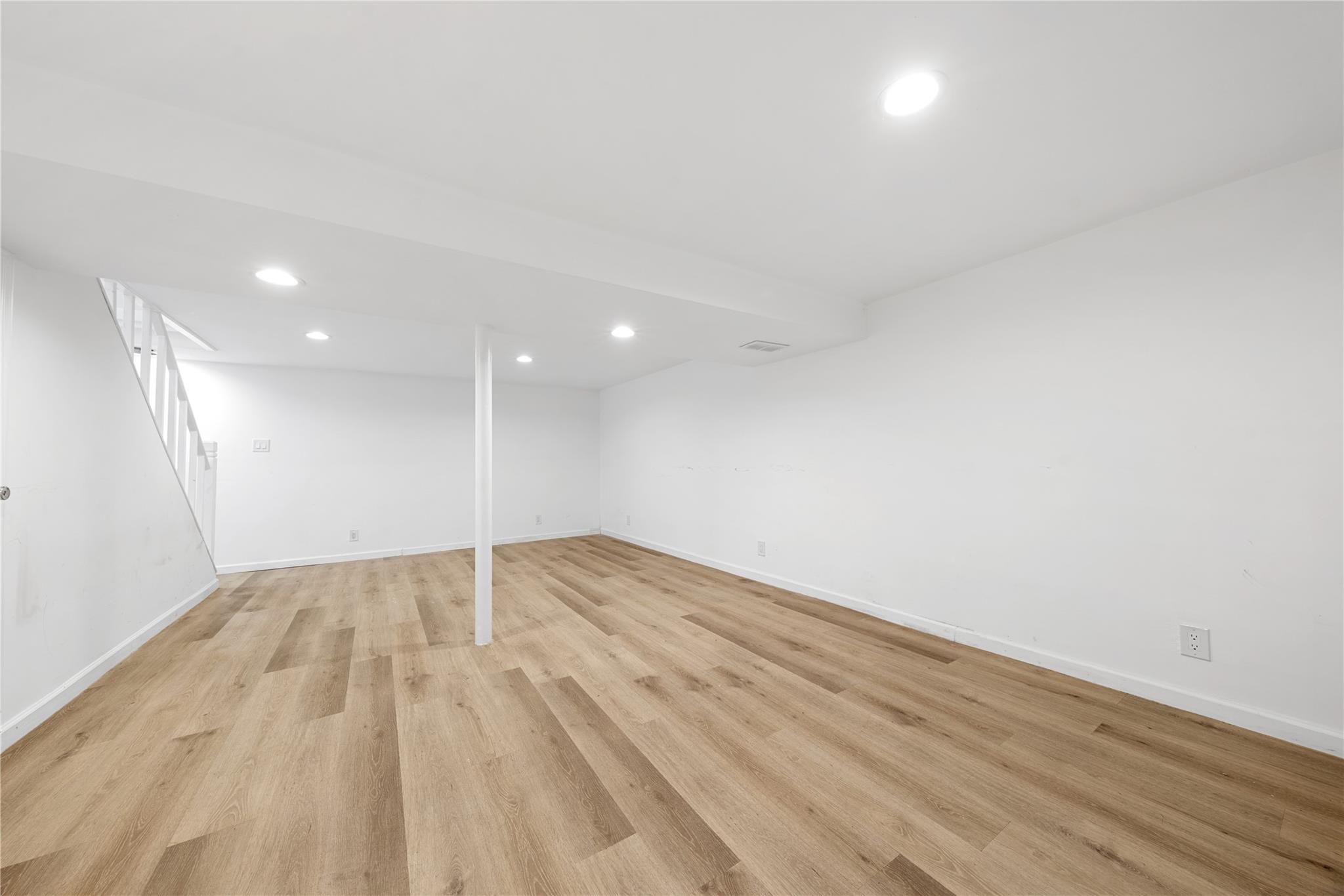 51 Joline Road Port Jefferson Station, NY 11776 - Photo 32 of 38 a view of an empty room and wooden floor