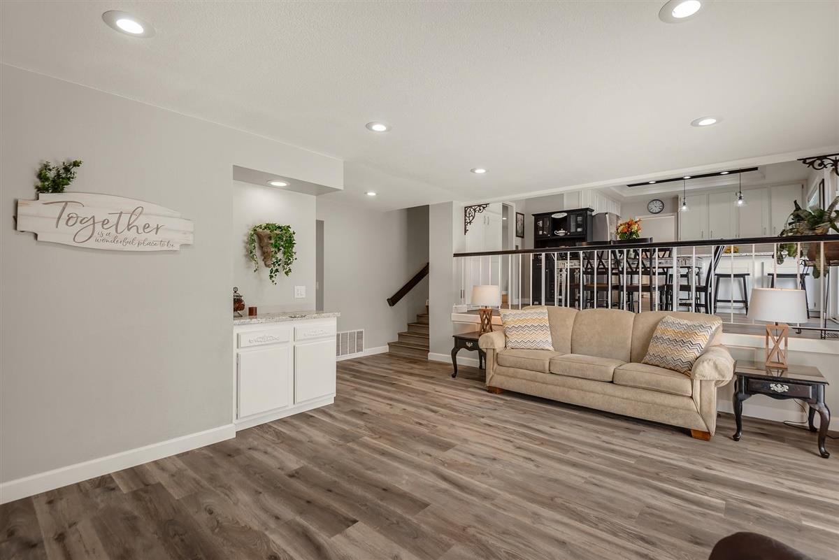 1428 Eagles Nest Lane Gilroy, CA 95020 - Photo 20 of 38 a living room with furniture and a wooden floor