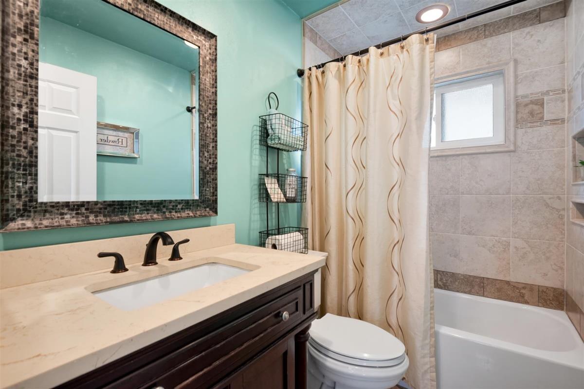 1428 Eagles Nest Lane Gilroy, CA 95020 - Photo 27 of 38 a bathroom with a sink a toilet and a bathtub