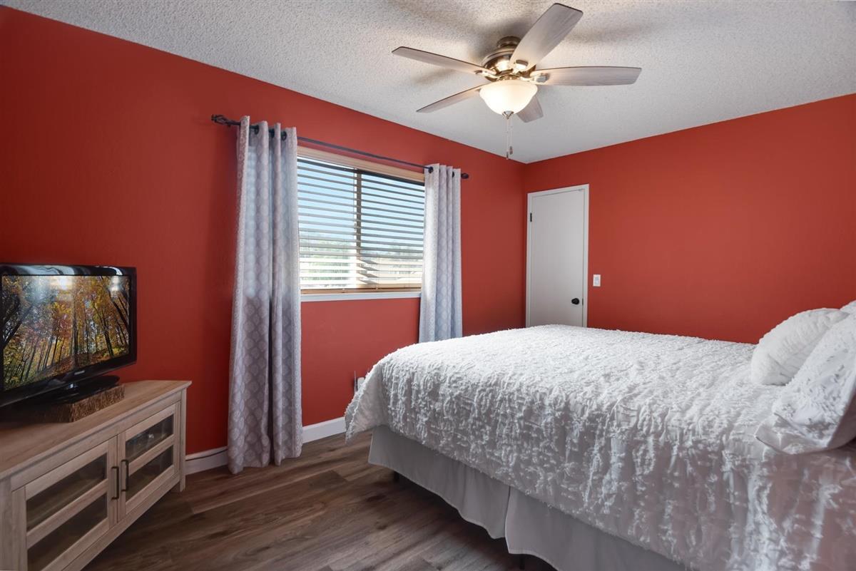1428 Eagles Nest Lane Gilroy, CA 95020 - Photo 29 of 38 a bedroom with a bed and a flat screen tv
