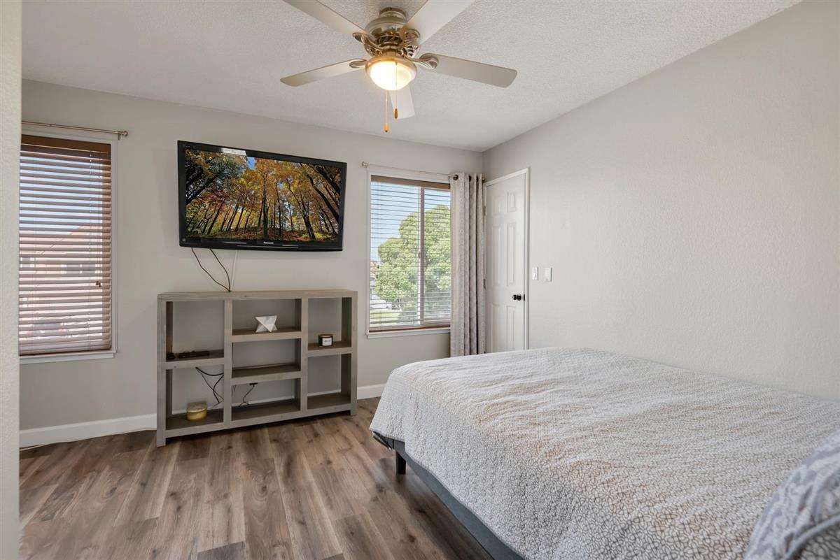 1428 Eagles Nest Lane Gilroy, CA 95020 - Photo 30 of 38 a bedroom with a bed and a flat screen tv