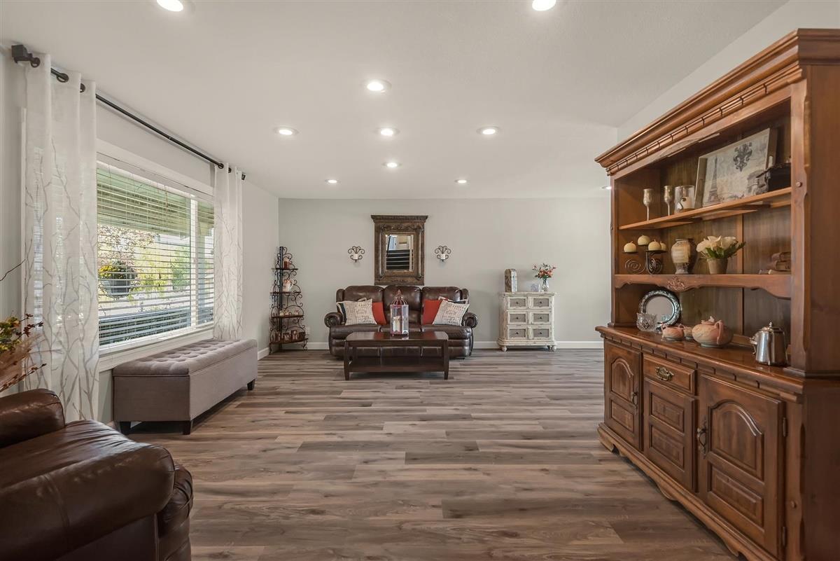 1428 Eagles Nest Lane Gilroy, CA 95020 - Photo 6 of 38 a living room with furniture and a flat screen tv