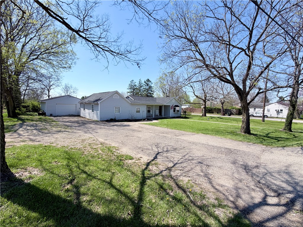 6800 Farmington Road Miamisburg, OH 45342 - Photo 2 of 32 This charming home features a detached garage and a spacious front yard, offering comfort and convenience.