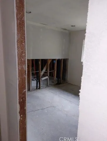 a view of room with a window and fireplace