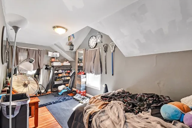 a bedroom with bed and a window