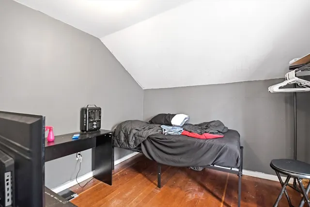 a bedroom with a bed and a table in it