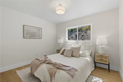 a bedroom with a bed and a chair