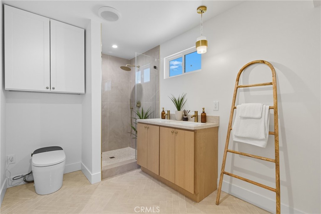 226 Tennyson Street Thousand Oaks, CA 91360 - Photo 21 of 27 a bathroom with a sink a toilet and a mirror