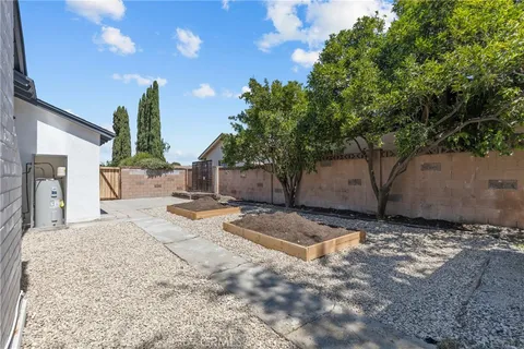 a view of a backyard with large tree