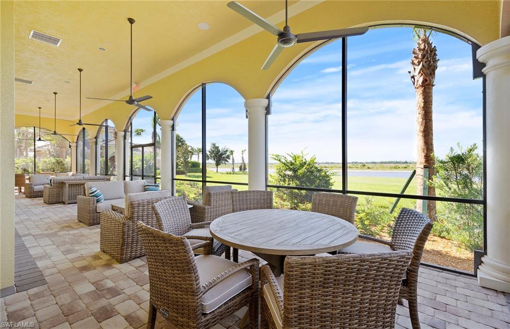 5693 Mayflower Way, Unit 1107 Ave Maria, FL 34142 - Photo 40 of 46 a view of a dining room with furniture window and outside view