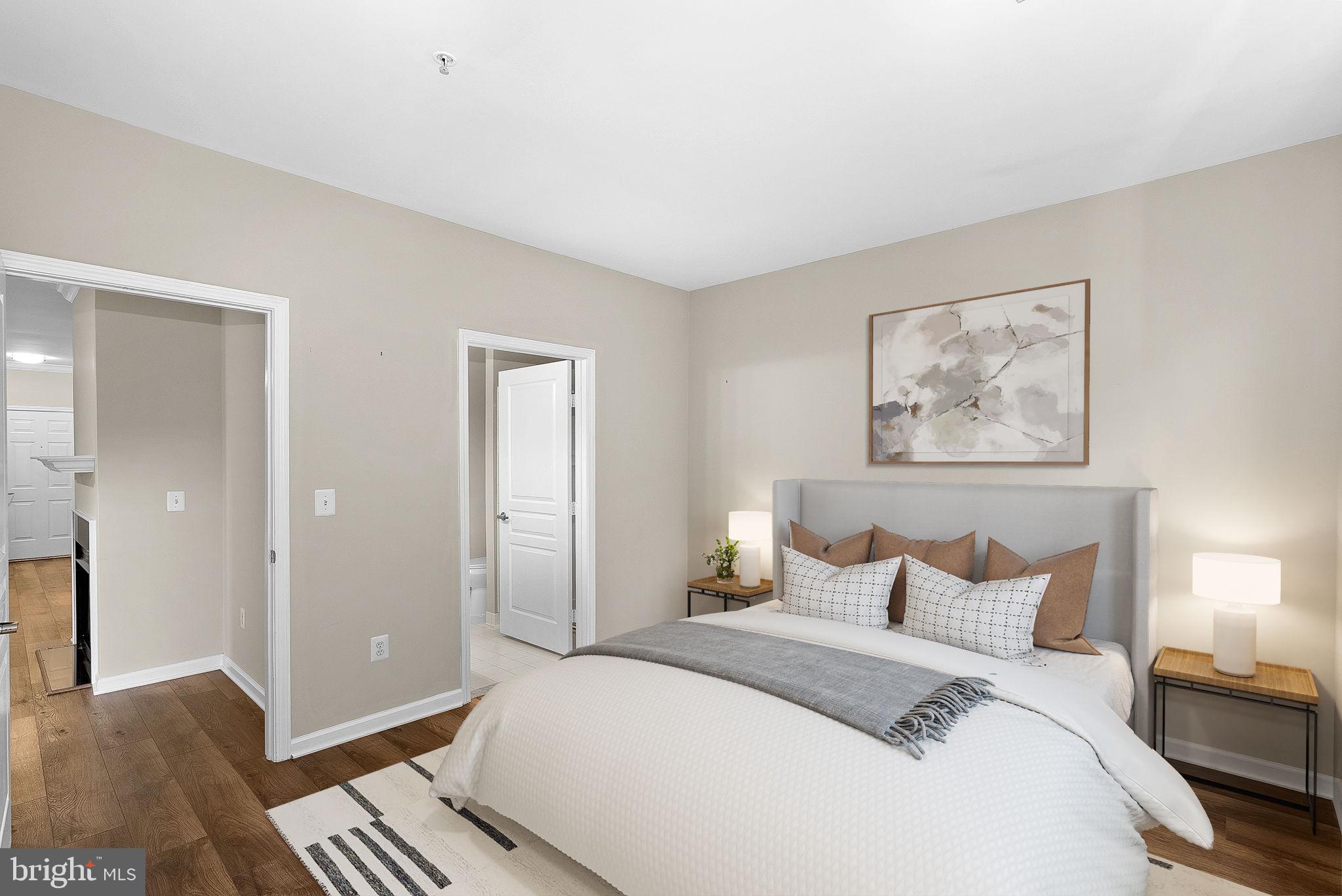 12000 Market Street, Unit 329 Reston, VA 20190 - Photo 20 of 56 Serene bedroom with modern elegance.