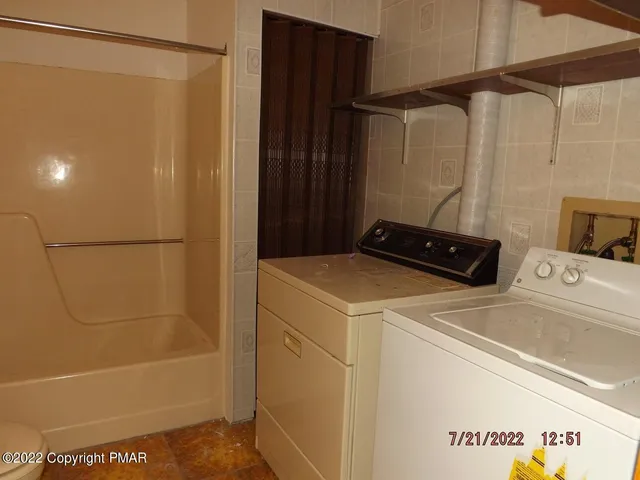 a bathroom with a shower and a sink