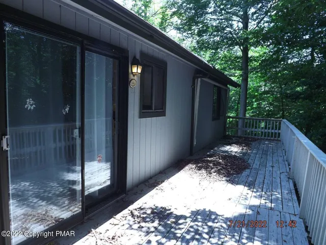 a view of backyard with small cabin