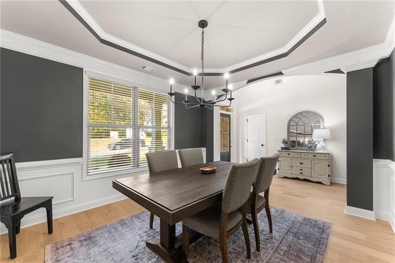 8055 Veranda Curve Ball Ground, GA 30107 - Photo 15 of 65 a view of a dining room with furniture window and wooden floor