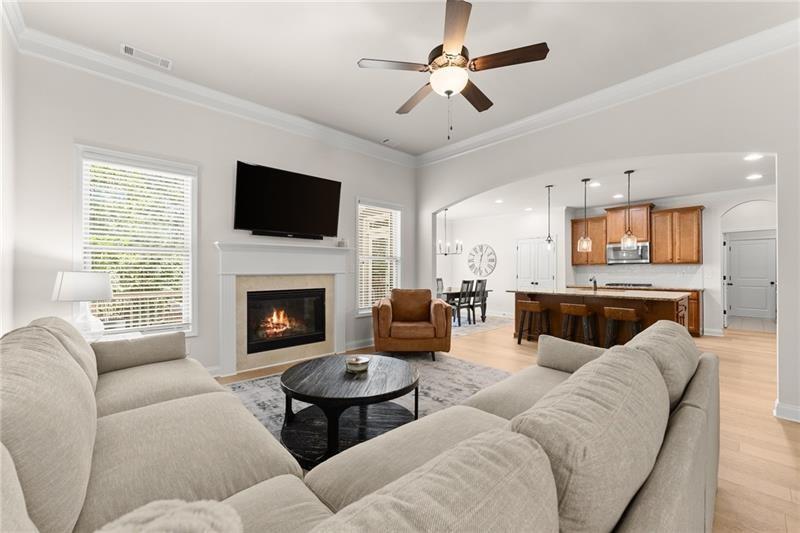 8055 Veranda Curve Ball Ground, GA 30107 - Photo 2 of 65 a living room with furniture fireplace and flat screen tv