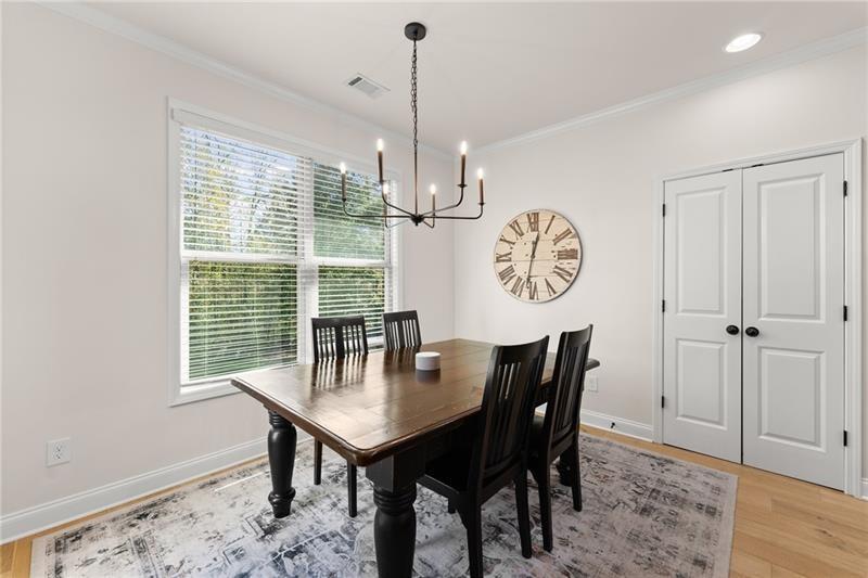 8055 Veranda Curve Ball Ground, GA 30107 - Photo 22 of 65 a view of a dining room with furniture window and wooden floor