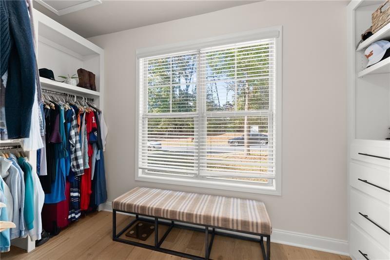 8055 Veranda Curve Ball Ground, GA 30107 - Photo 36 of 65 a bedroom with a bed and a window