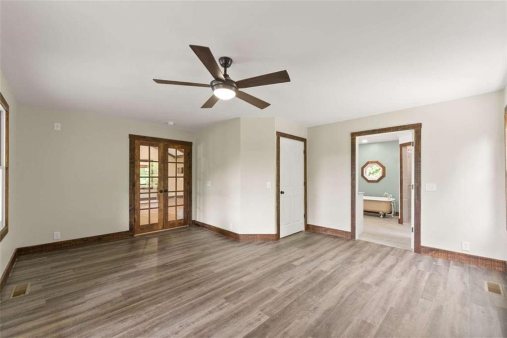 707 South Fern Cove Road Sautee Nacoochee, GA 30571 - Photo 21 of 60 a view of an empty room with window and wooden floor