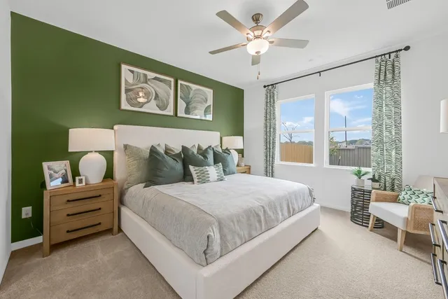 a bedroom with a bed and a dresser