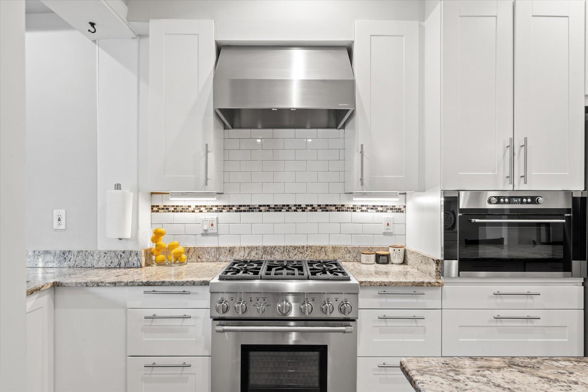 2305 38th Street Northwest Washington, DC 20007 - Photo 10 of 38 a stove top oven sitting inside of a kitchen