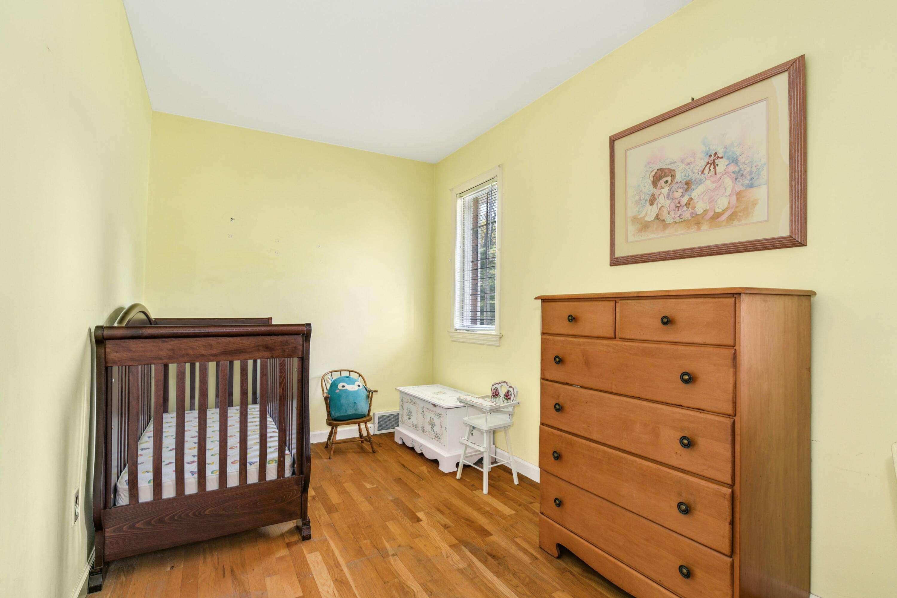 529 Smith Ridge Road New Canaan, CT 06840 - Photo 22 of 39 a bedroom with a bed and a window