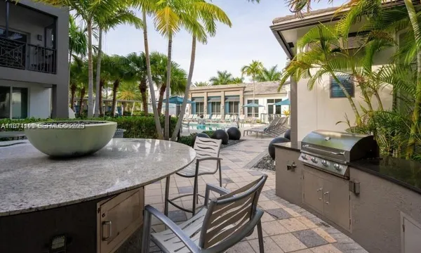 a view of a backyard with sitting area and furniture